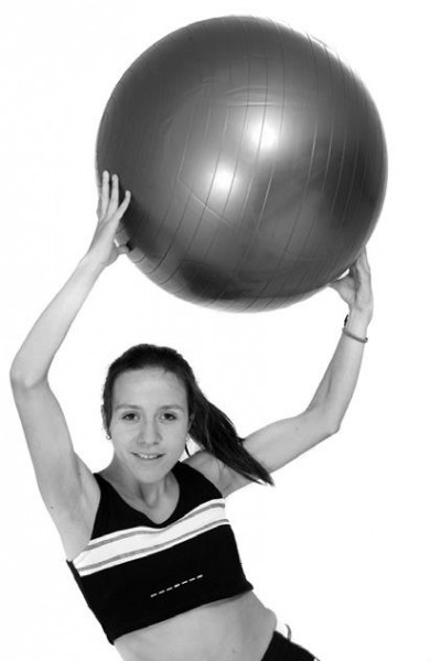 woman holding yoga ball