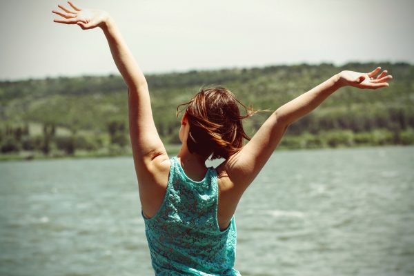 woman with arms in the air