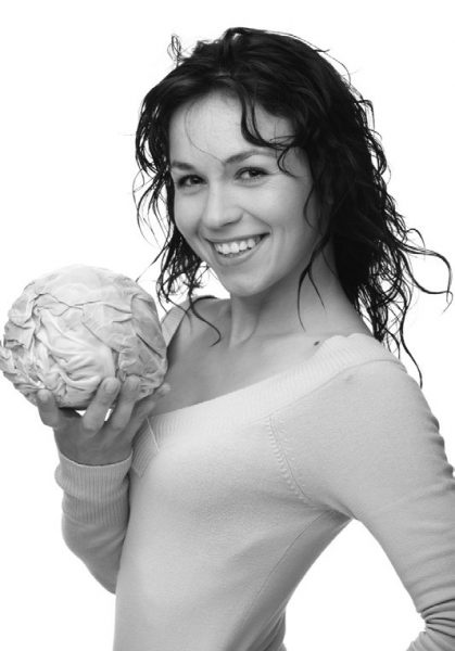 woman holding cabbage