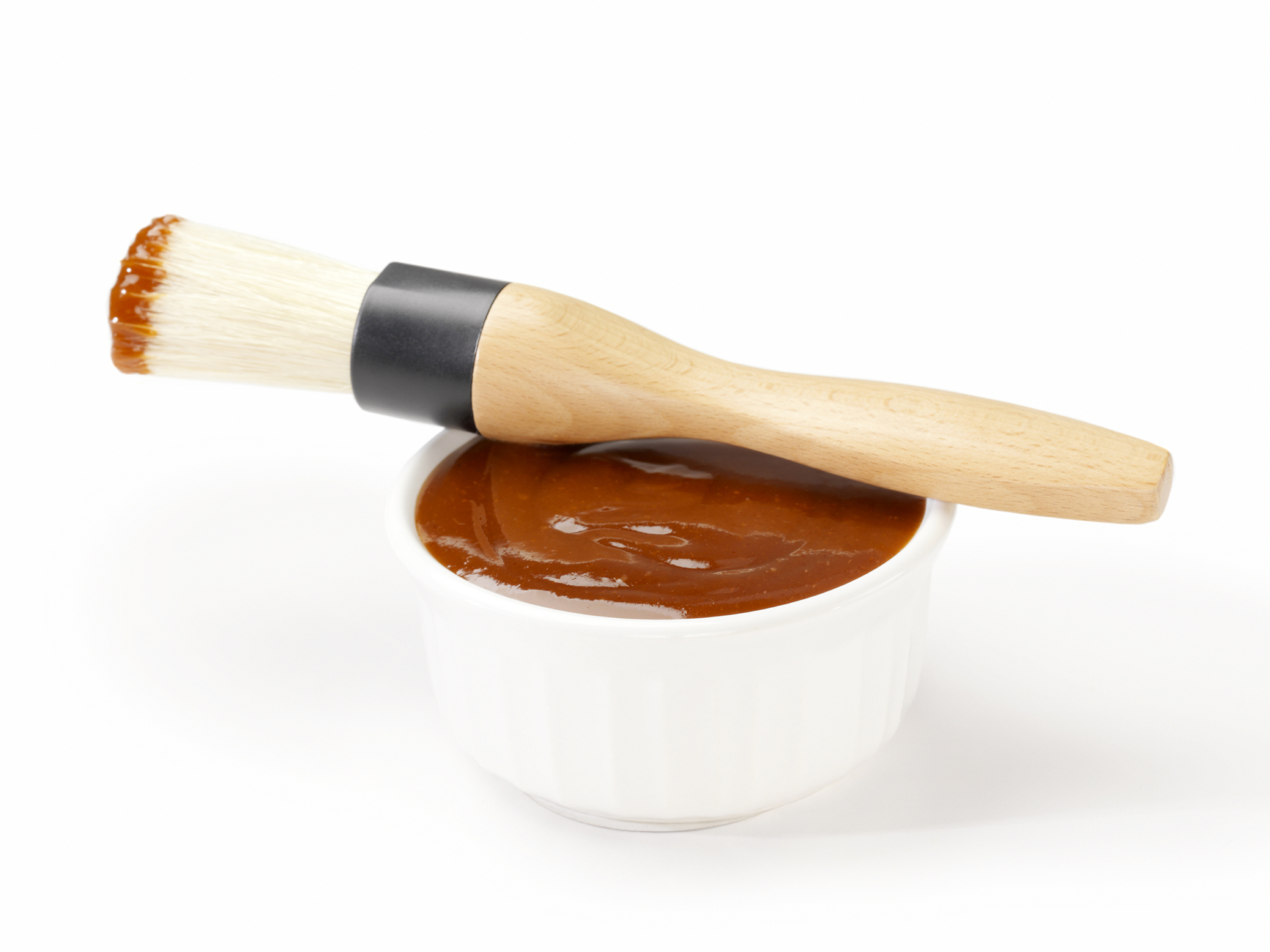BBQ sauce in bowl with brush